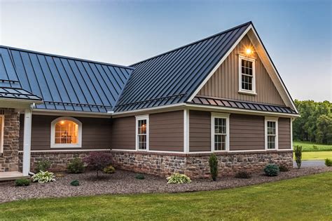 brick house with grey metal roof|homes with brown metal roofs.